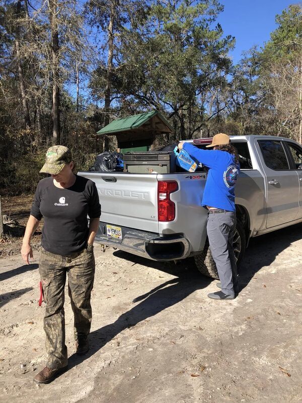 [Suzy and Will loading Bobby's truck at Sasser Landing --Russell Allen McBride]