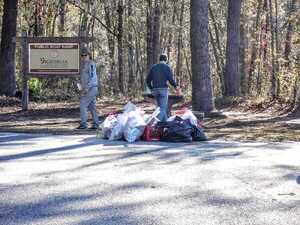 [Bird Chamberlain and David Rodock with trash bags at Statenville --Suzy Hall]