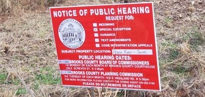 [Closeup, rezoning notice sign, 17:43:39, 30.9510626, -83.4834273]