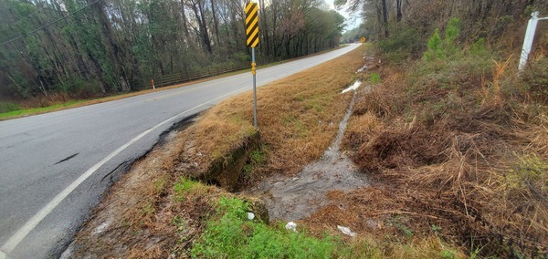 [Rainwater down ditch from rezoning sign, 16:04:18, 31.0132866, -83.3079949]