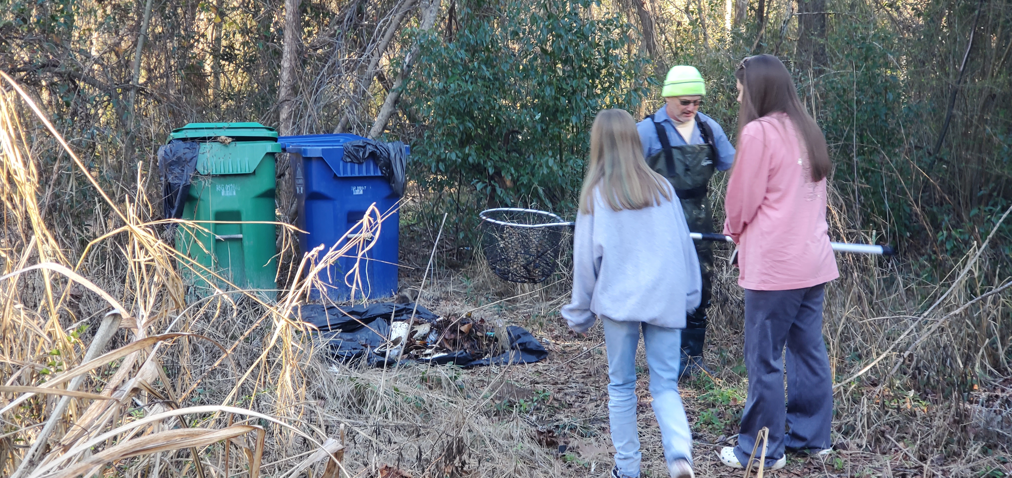 Russell and relatives at the trash cans