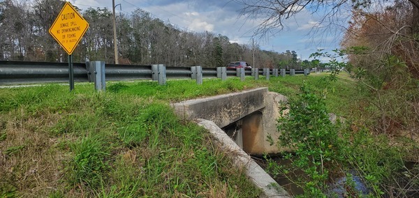 [Warning sign with US 84 dual box culvert over Knights Creek, 15:34:40, 30.8439323, -83.2429710]