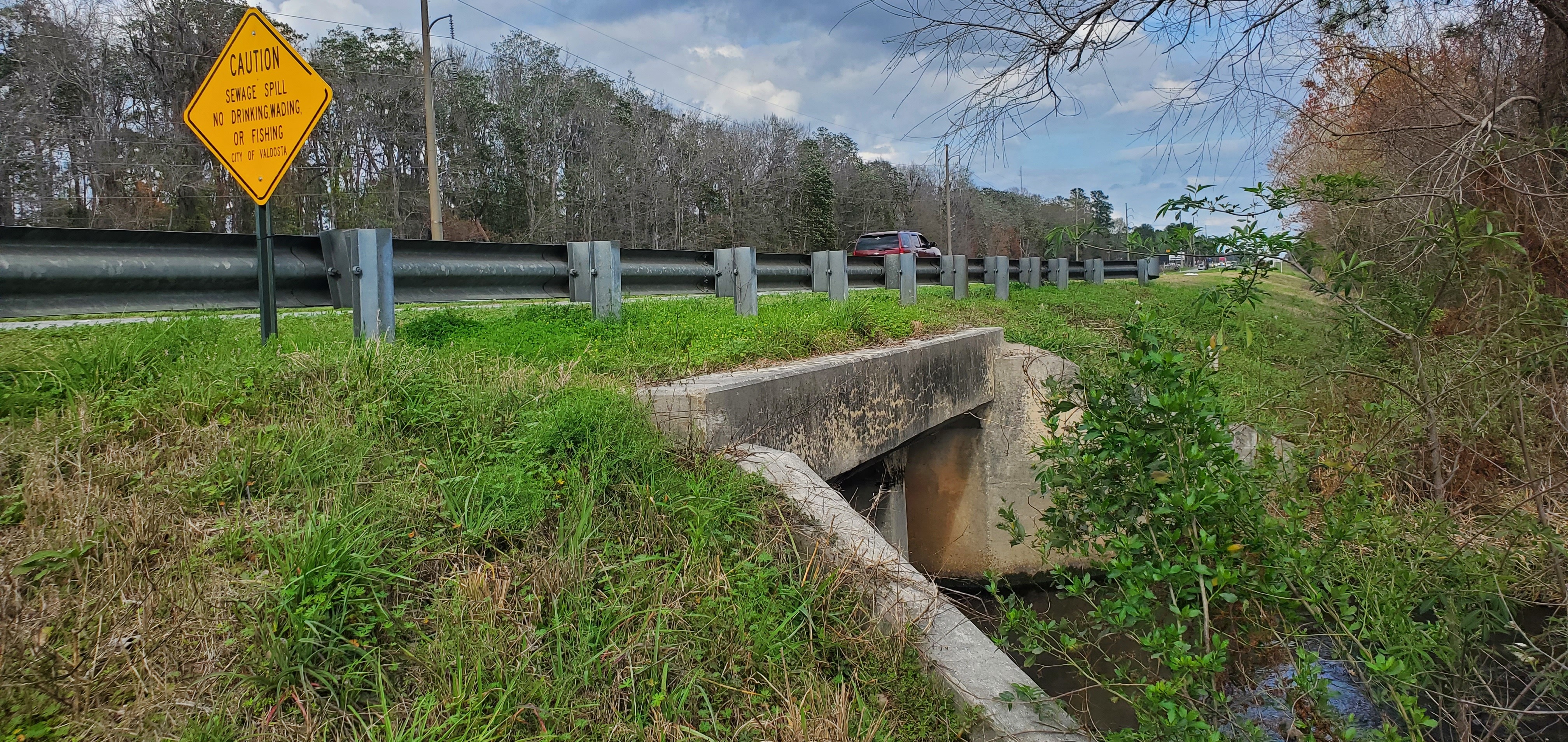 Warning sign with US 84 dual box culvert over Knights Creek, 15:34:40, 30.8439323, -83.2429710