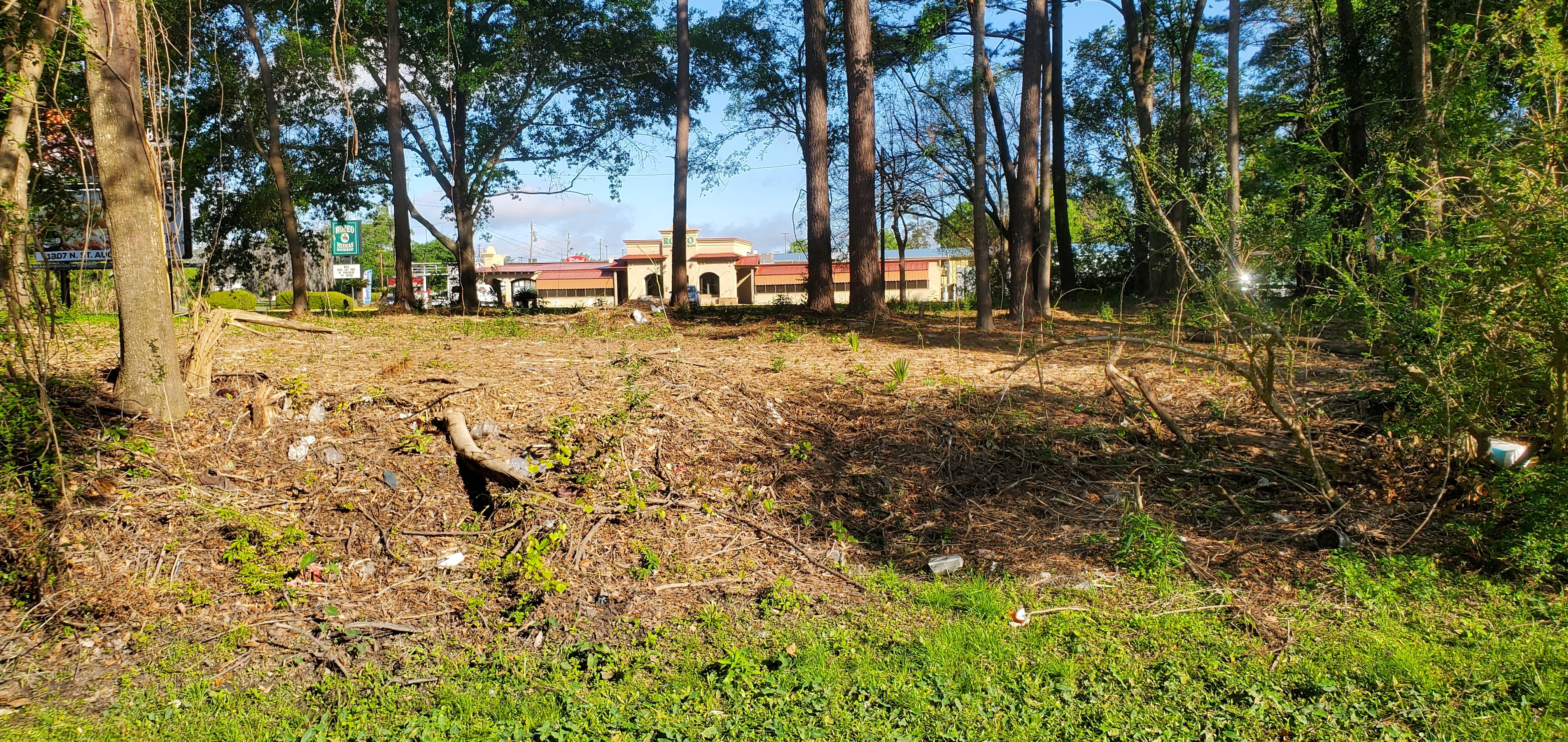 Trash at Two Mile Branch with Rodeo restaurant in background, 2023:03:24 09:45:45, 30.8674982, -83.2861608