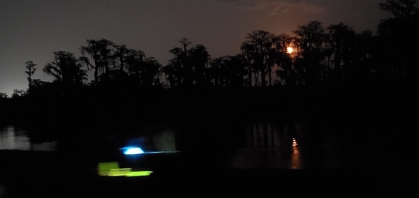 [Boat lights and moonlight]