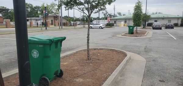 Trash cans in parking lot and Customer Service