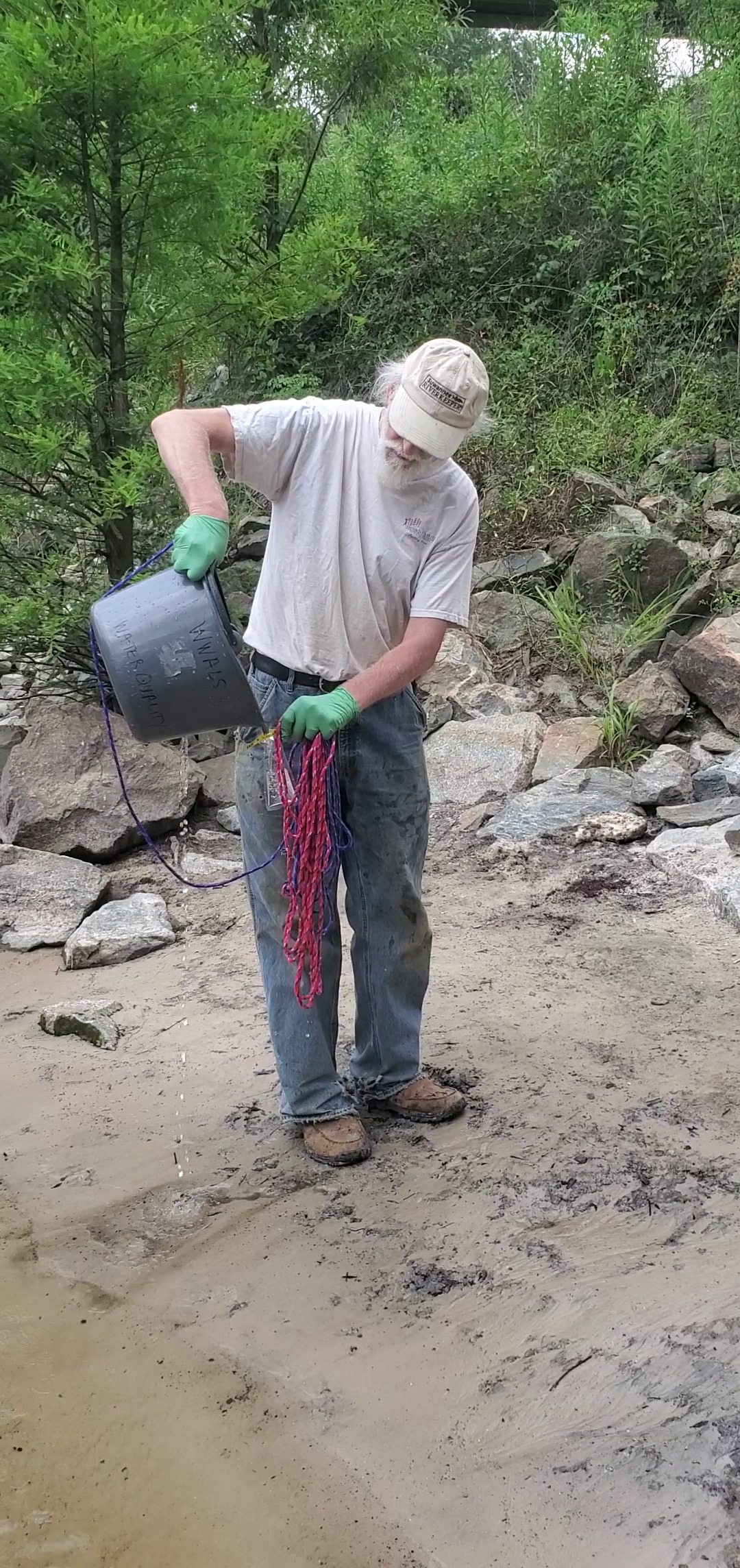 Pour water from the bucket into the WhirlPak