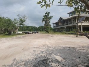 [Chainsaw Cleanup paddlers at Fargo Ramp with defunct Suwannee River Welcome Center, 10:18:44, 30.6821440, -82.5597990]