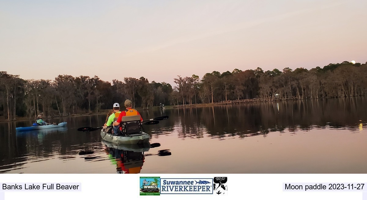 [Full moon rising over Holly Jones and family in the raffle kayak they won 2022-12-07]