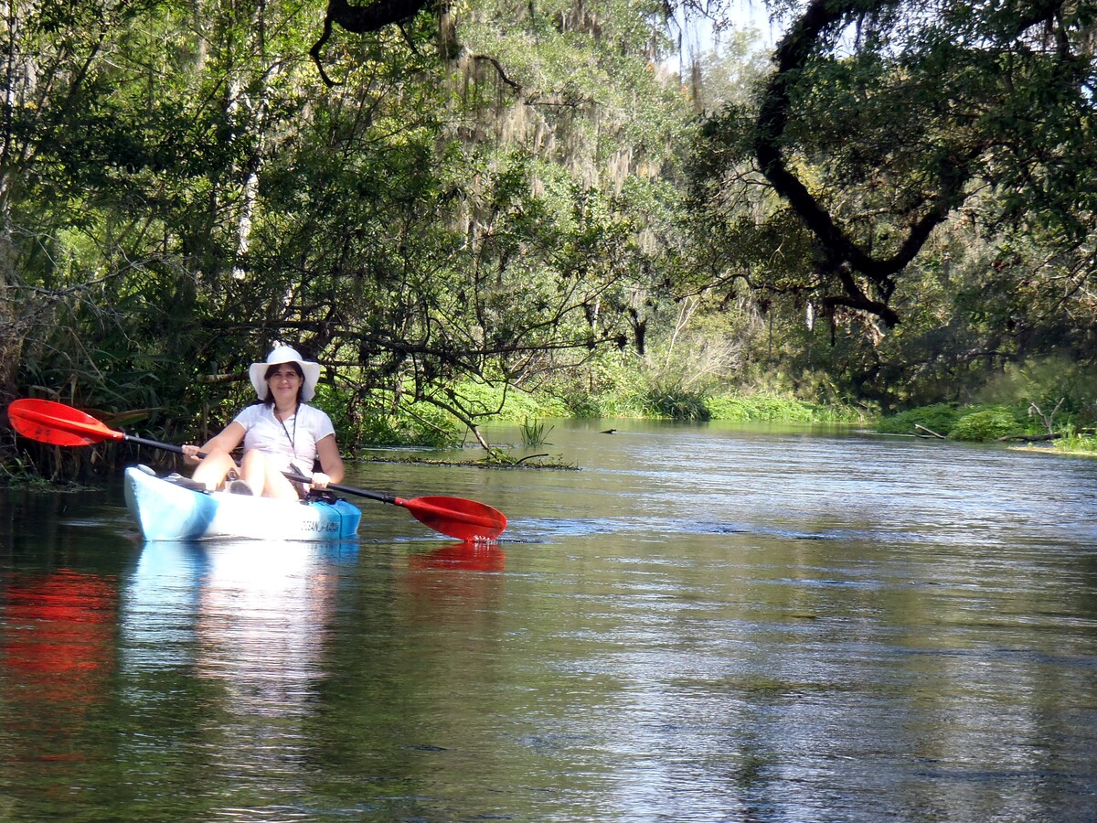 [Janet Martin in a kayak on a river]