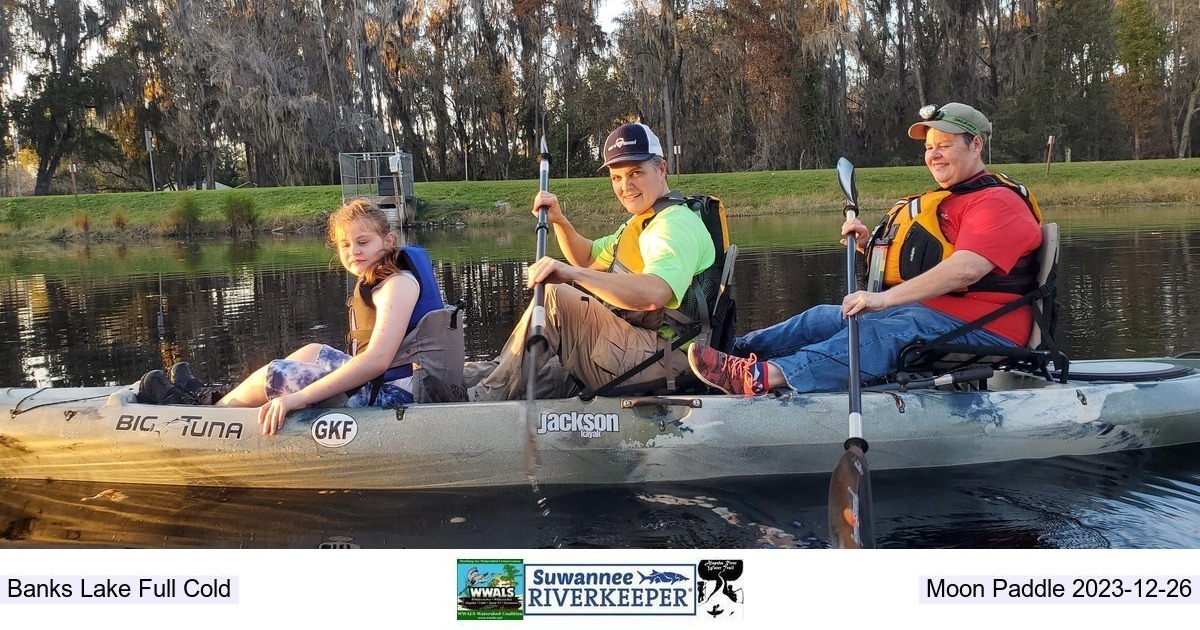 [Holly Jones and family in raffle kayak they won 2022-12-07]