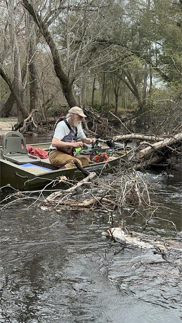 [Suwannee Riverkeeper sawing a deadfall --Bobby McKenzie, 30.8451896, -83.3466904]