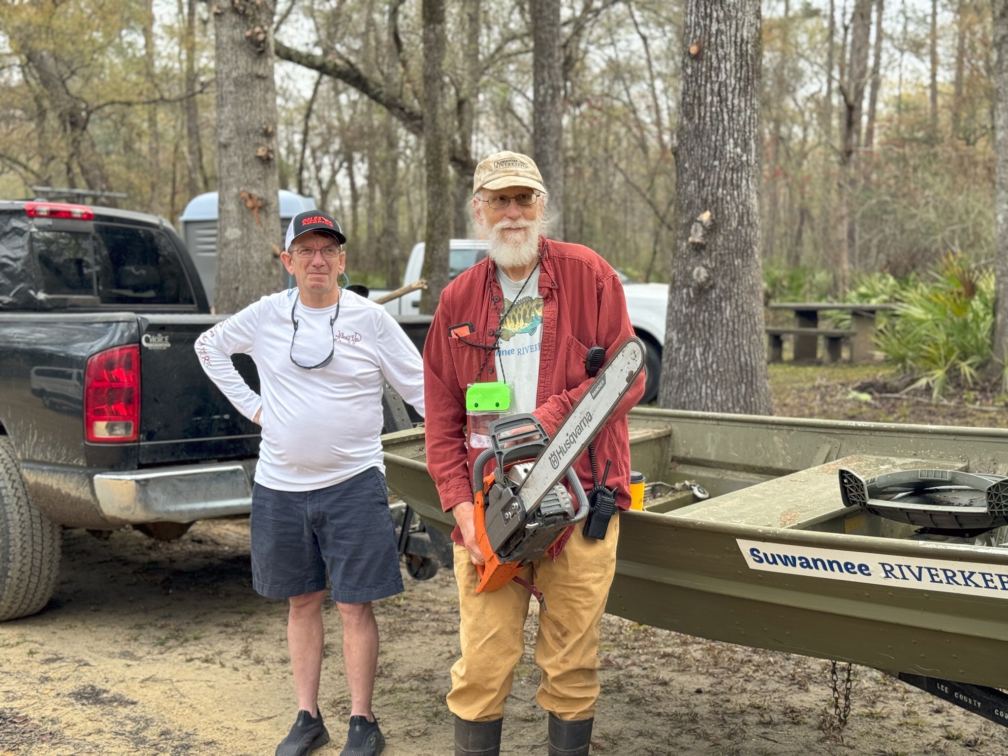 Phil Royce, Suwannee Riverkeeper John S. Quarterman with Wild Green Future Chainsaw and Suwannee Riverkeeper jon boat --Valdosta, A City Without Limits