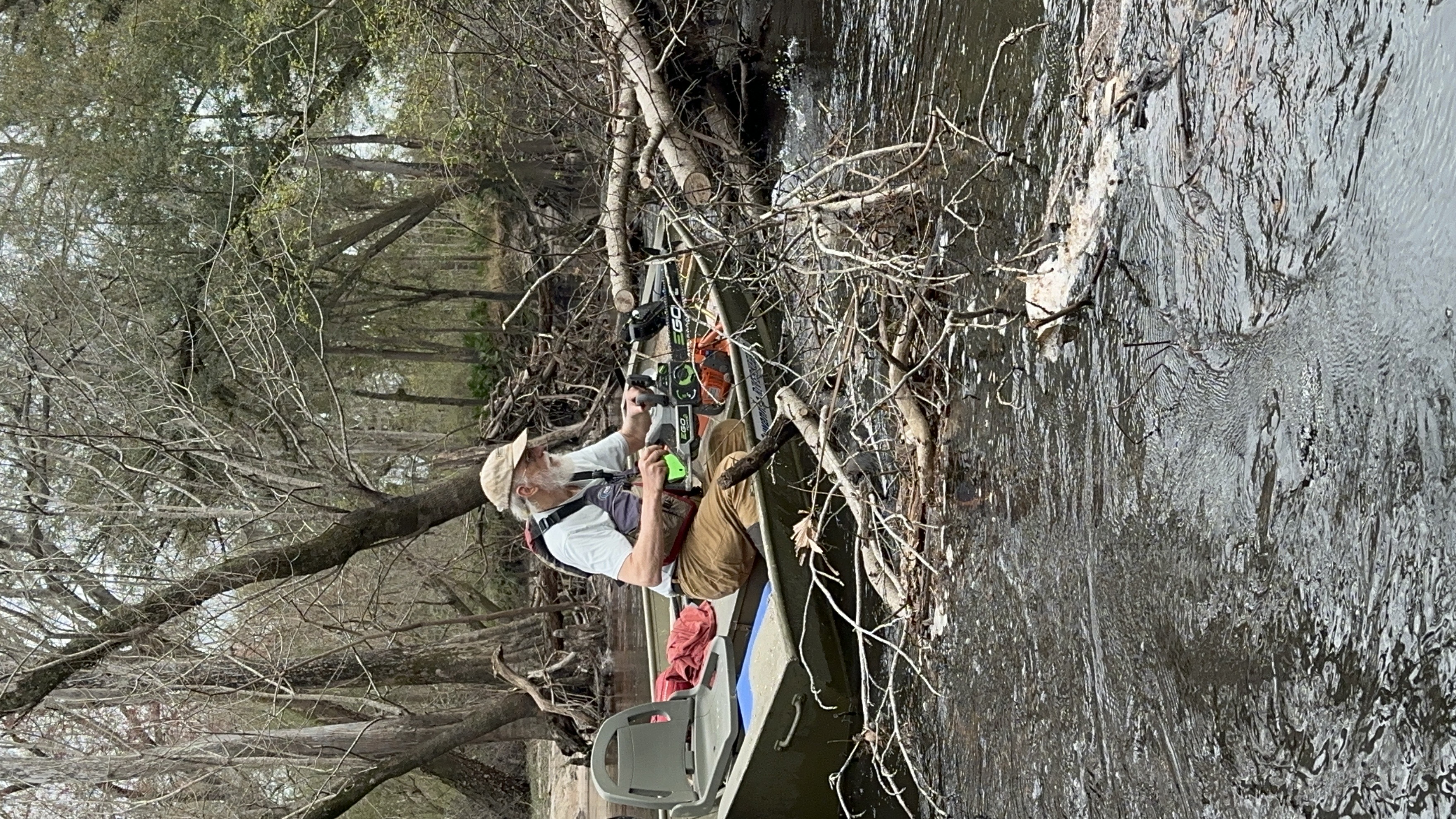 Suwannee Riverkeeper sawing a deadfall --Bobby McKenzie, 30.8451896, -83.3466904