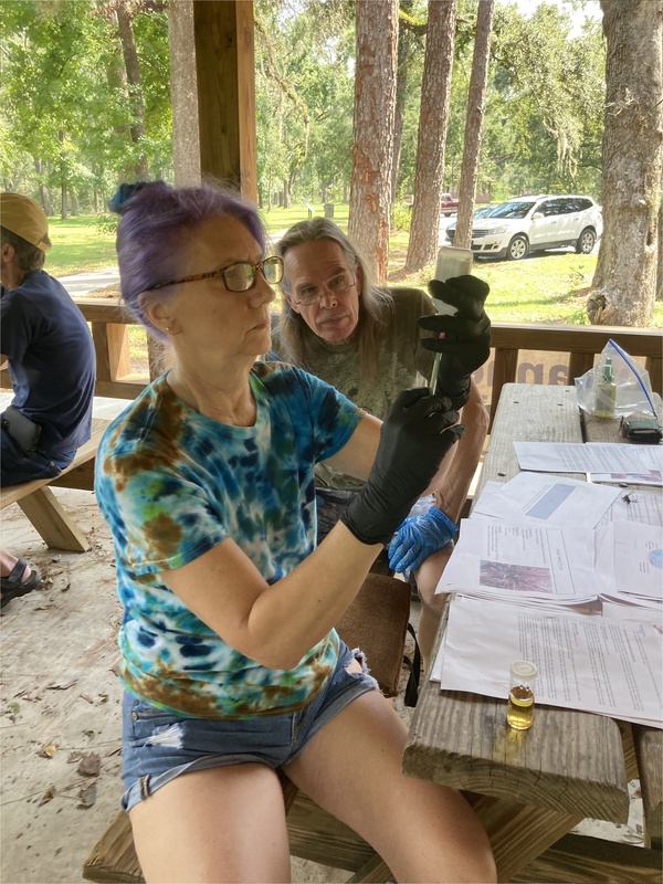 [Terry and Andy Phelan, Fort White, FL, getting sodium thiosulfate for titration of DO]