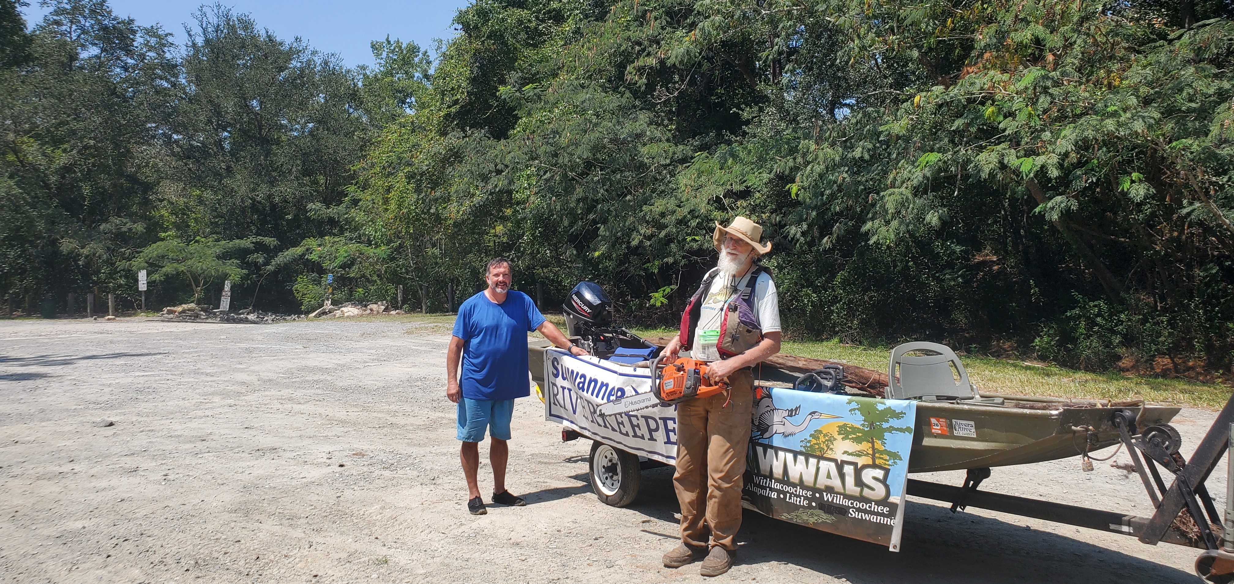 Banners with Husqvarna gas chainsaw, 12:39:08, 30.8515981, -83.3469642