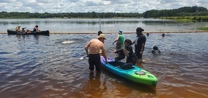 [Child deposited into a kayak, 12:58:56]