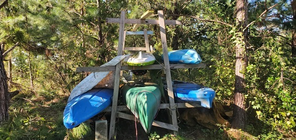 [Kayaks and Canoes; Raffle kayak is top center; Canoe also belongs to WWALS]