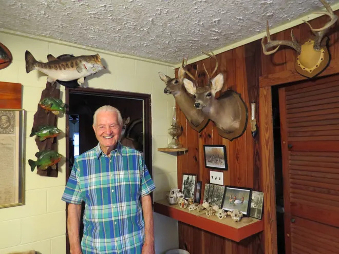 Alphin Griffis at the Griffis Camp office, near Fargo, Georgia. The office is home to dozens of well-prepared mounts of animals native to the swamp (as a young man, Griffis taught himself the craft of taxidermy). [Dirk Stevenson/for Savannah Morning News]