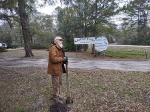 [jsq digging in front of the Griffis Camp signs --Richard Fowler]