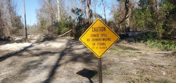 [Sewage Spill sign, Sugar Creek, 13:44:51, 30.8621769, -83.3188244]