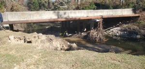 [Valdosta City personnel under Gornto Road Bridge, preparing deadfall removal]