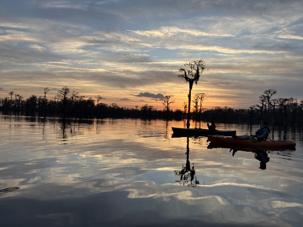 [Boats backlit by sunset --Gretchen Quarterman]