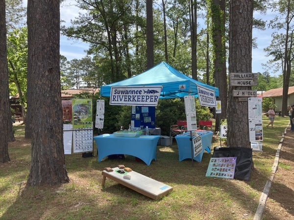 [WWALS booth with froggy toss --Gretchen Quarterman]