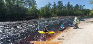 [A canoe arriving at the beach, Suwannee River --jsq for WWALS, 2025-05-31, 11:28:12, 30.3387210, -82.6837207]