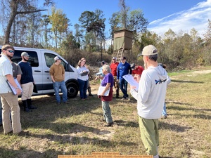 [Heather at a deer stand, 2025:11:21 11:41:18, 31.3893472, -83.2170556 --Gretchen Quarterman for WWALS]