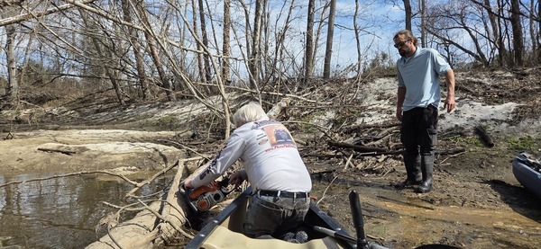 [Phil Hubbard already got his saw stuck, as David Savage watches, 2026:02:14 12:24:54, 30.8629143, -83.3189591]