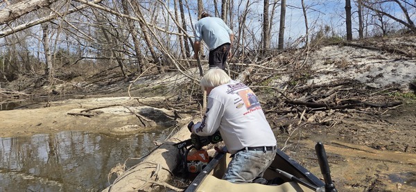 David Savage moving debris while Phil Hubbard saws, 2026:02:14 12:27:07, 30.8629247, -83.3189509