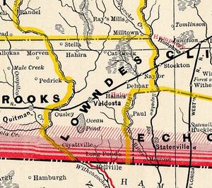 [Lowndes County, 1885b, Source: George Cram Railroad and County Map of Georgia, 1885, with the “Withcacoochee” River and the Alapahoochee River labeled “Withlocoochee River”. Quitman, Ousley, Valdosta, Haines, Delmar, and Stockton all on the railroad, but no Troupville.]