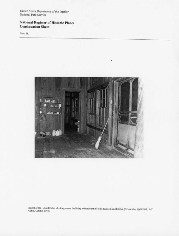 Photo 18: Interior of the Hebard Cabin - looking across the living room toward the west bedroom and kitchen [G1 on Map 6] (ONWR, Jeff Aicher, October 1994),