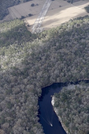 [W. across boat, Suwannee River, SRSP, HDD, all the red pipe, 30.409129, -83.157900]