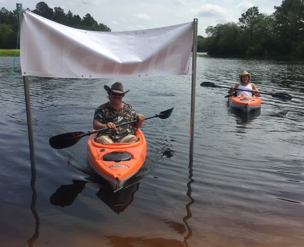 #? Two kayaks, one male, one female (BW)