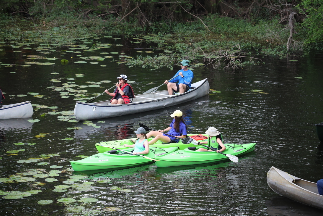 Trio of green girl kayaks