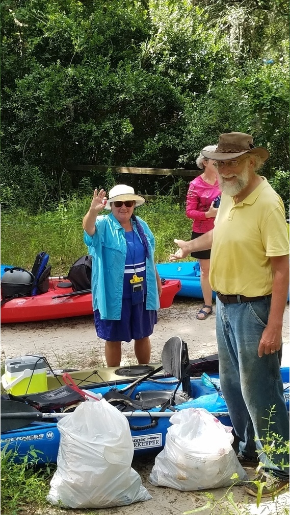 Julie Bowland with the fishing float she collected, 30.48012, -83.24475