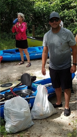 [Kerry Sullivan with trash we collected (Shirley Kokidko in background), 30.48014, -83.24466]