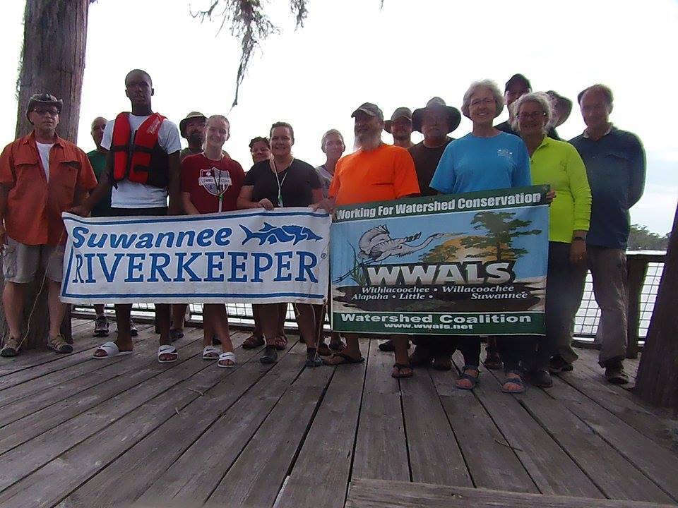 Paddlers with WWALS and Suwannee Riverkeeper Banners