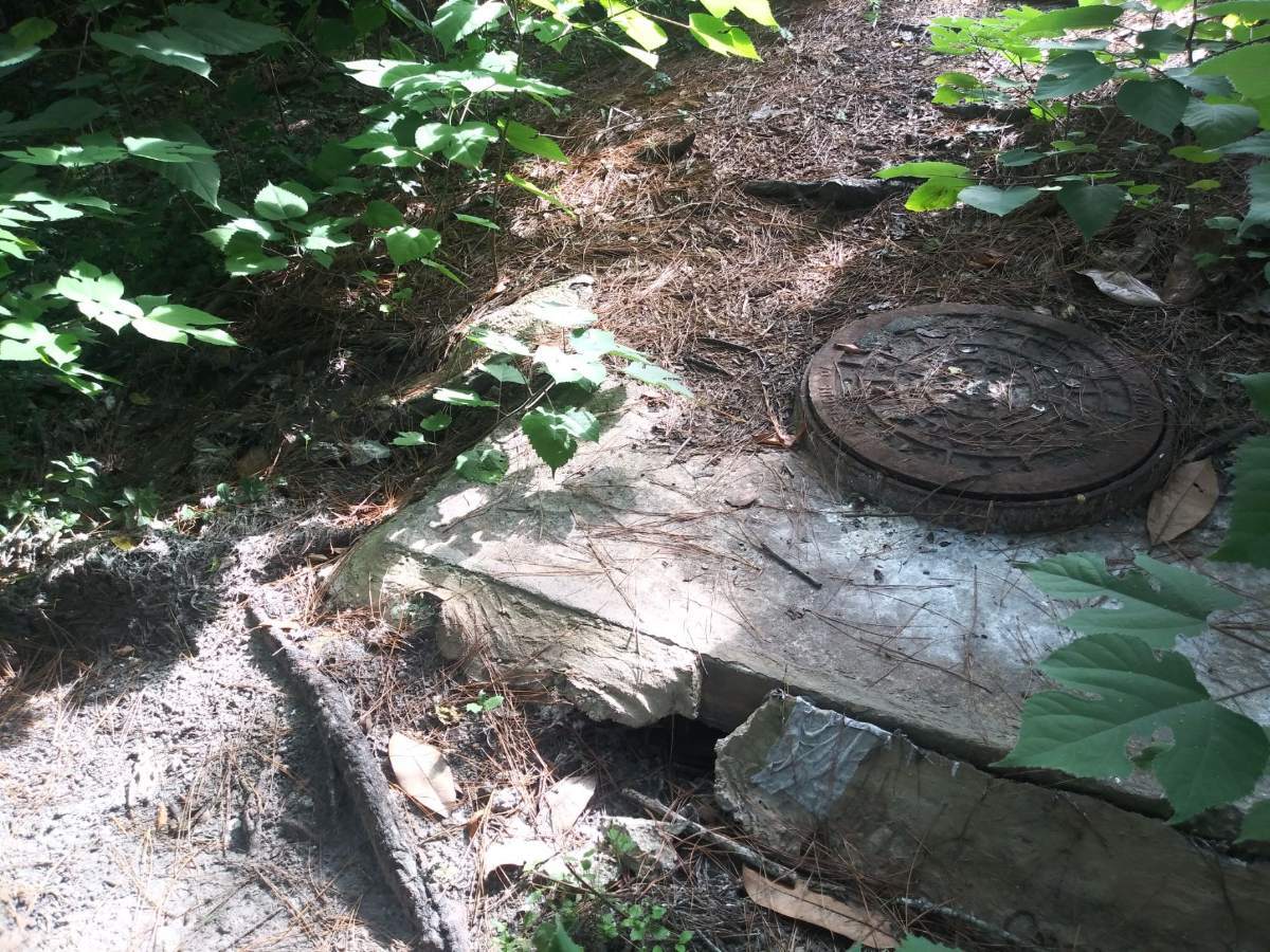 Closed manhole at 1208 Wainwright Drive