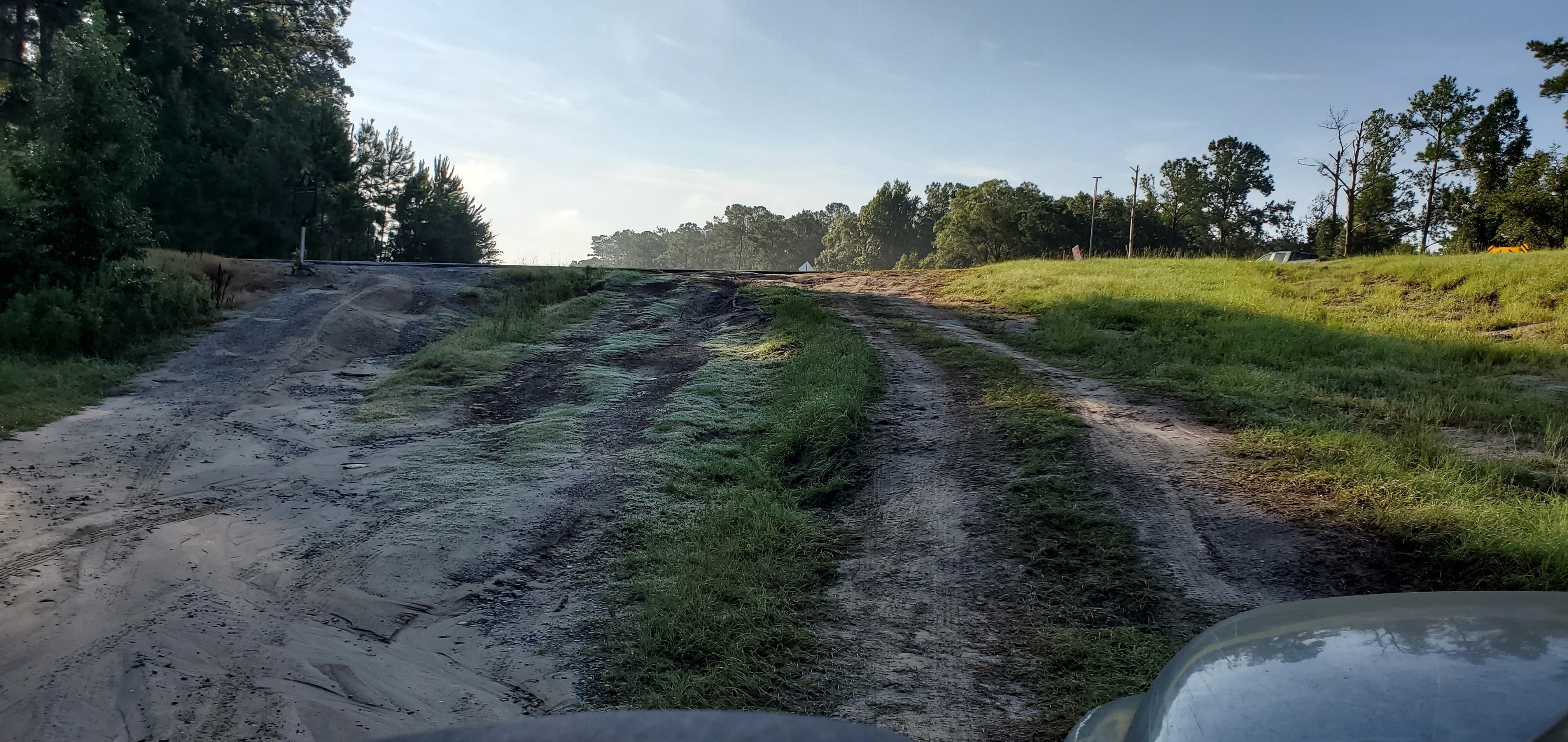 Deep potholes, entrance road, Folsom Bridge