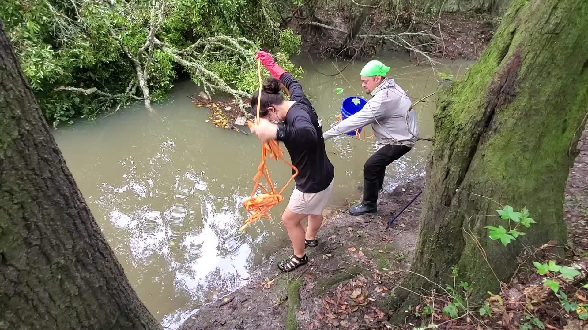 Movie: Scotti fishing for trash with bucket (163M)