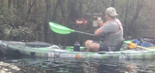 Bobby looking at the sign back to Minnies Lake Shelter, 14:04:10