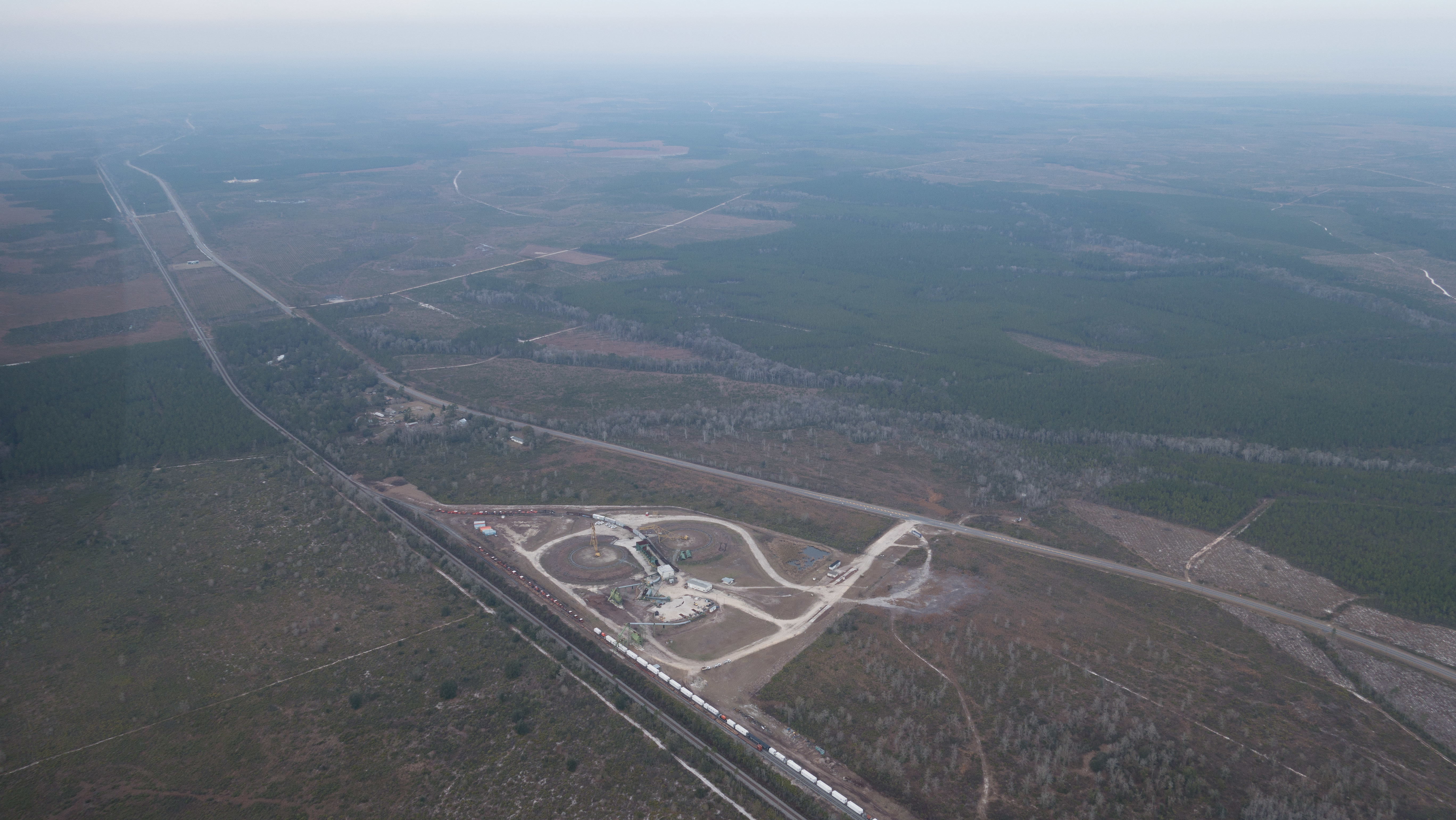 WNW: Chip Mill and mine site, ONWR on horizon, 30.516737, -82.081989