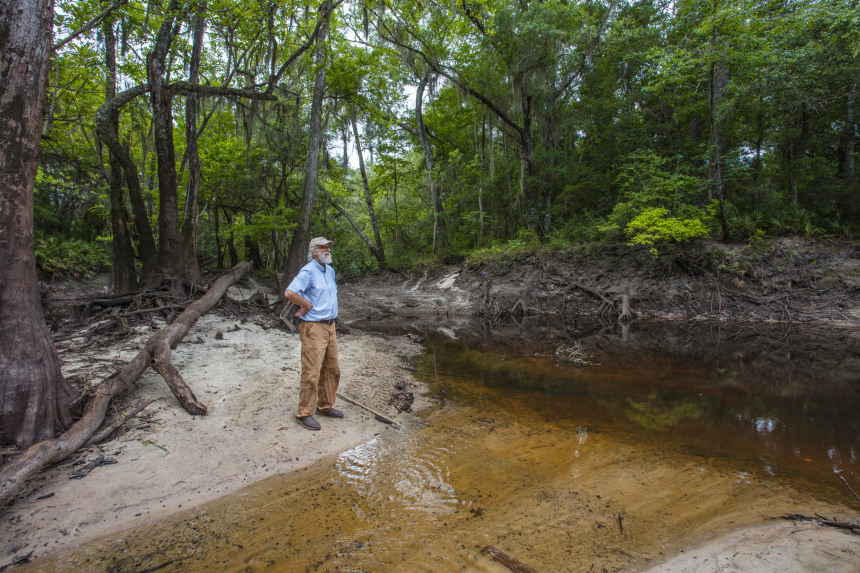 John Quarterman stands by the Withlacoochee River in Georgia. Matt Odom / for NBC News