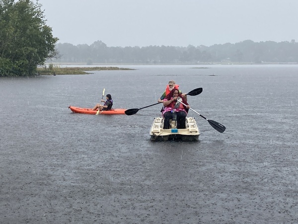 Fannie with a paddle in a boat