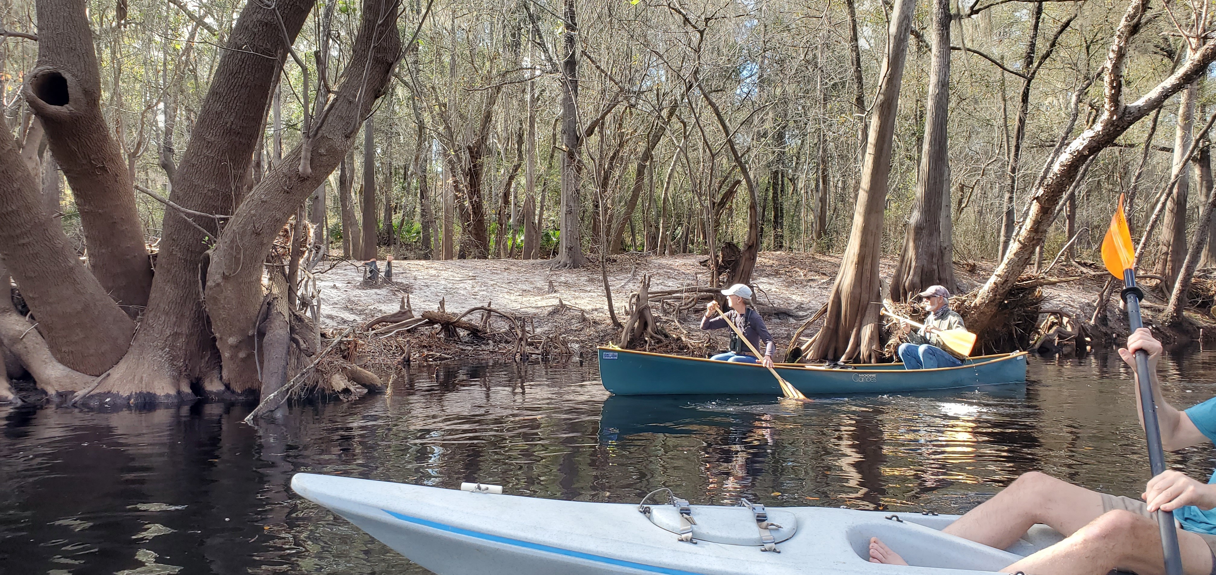 Paddlers and boots, 11:59:29, 30.5444536, -82.7205229