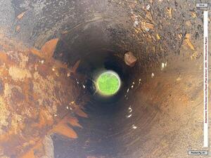 [Photo: WWTP sewer line repair During (pipe interior)]