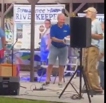 Mayor Scott James Matheson draws the winning kayak raffle ticket